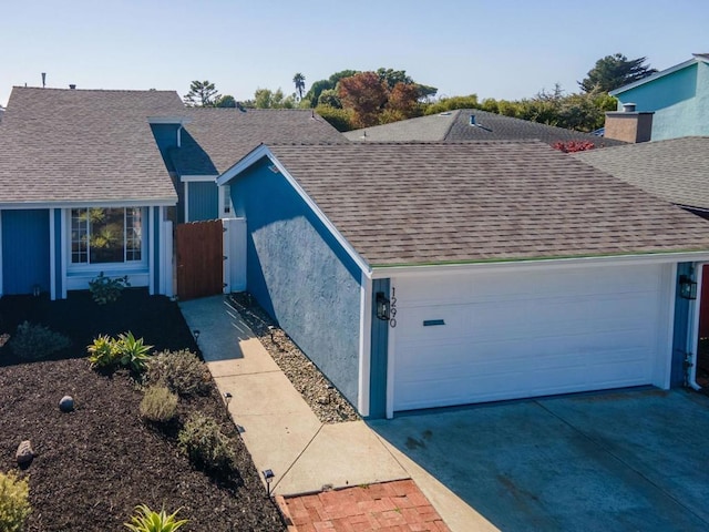 single story home featuring a garage