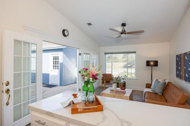 living room with lofted ceiling and ceiling fan