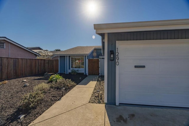 view of exterior entry featuring a garage