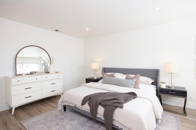 bedroom with light hardwood / wood-style floors