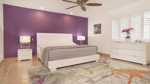 bedroom featuring light tile patterned flooring and ceiling fan