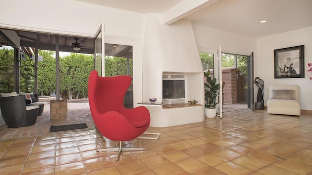 living room with beam ceiling