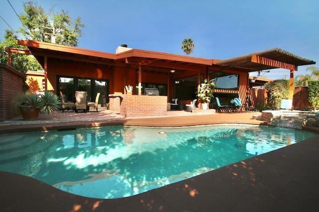 view of pool featuring a patio area