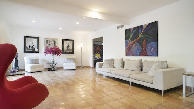 living room with beam ceiling