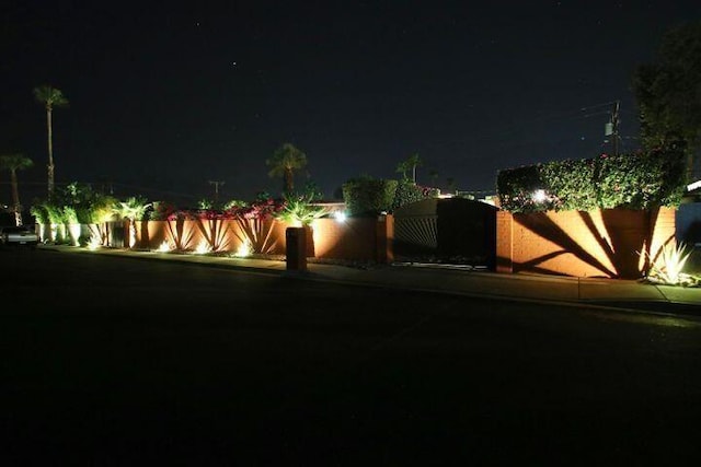 view of yard at twilight