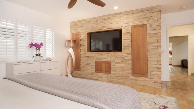 bedroom with light tile patterned flooring and ceiling fan