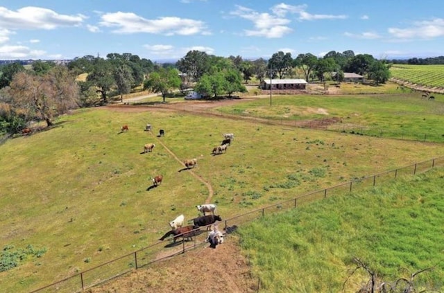 birds eye view of property with a rural view