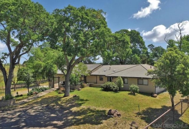 view of front of home with a front lawn