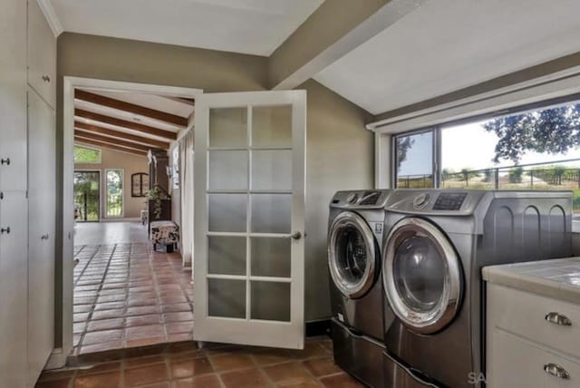 washroom with independent washer and dryer