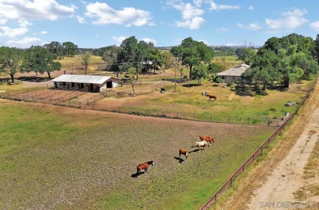 birds eye view of property with a rural view