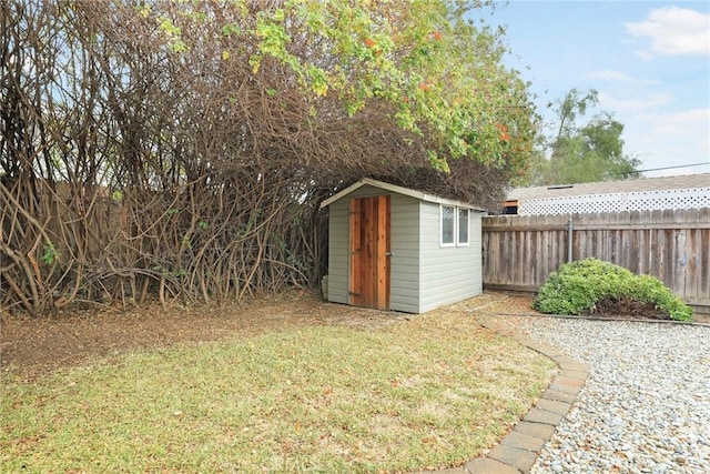 view of outbuilding featuring a lawn