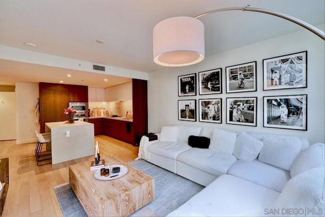 living room with light wood-type flooring