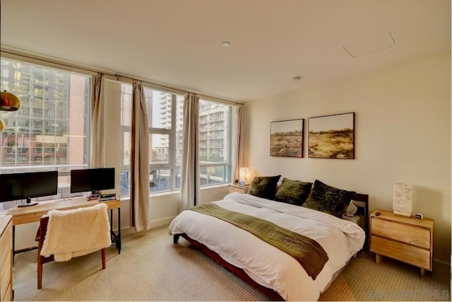 bedroom with light colored carpet