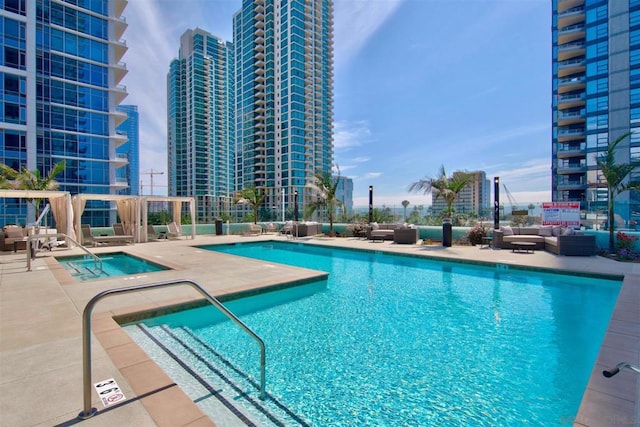 view of pool featuring an outdoor hangout area and a patio