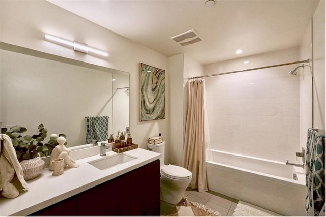 full bathroom featuring tile patterned flooring, shower / bath combo, vanity, and toilet