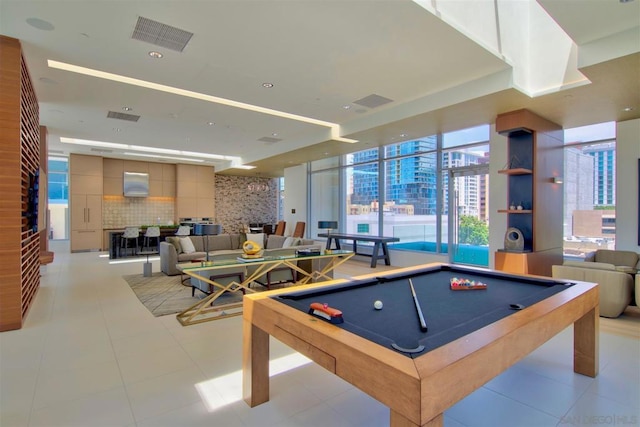 recreation room with light tile patterned flooring and pool table