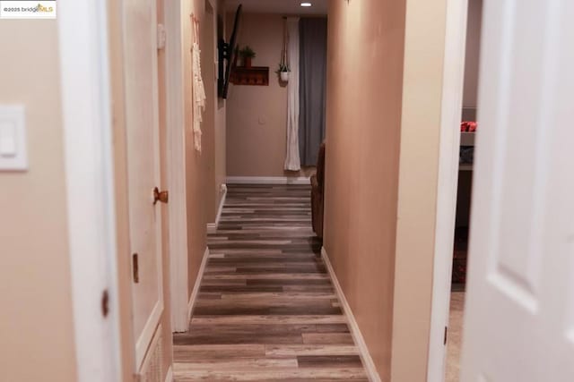 corridor featuring dark hardwood / wood-style flooring