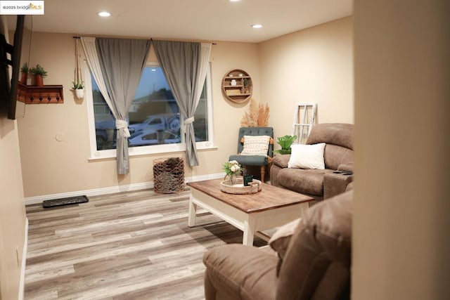 sitting room featuring light wood-type flooring