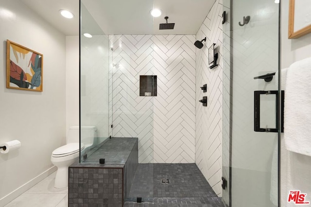 bathroom with walk in shower, toilet, and tile patterned flooring