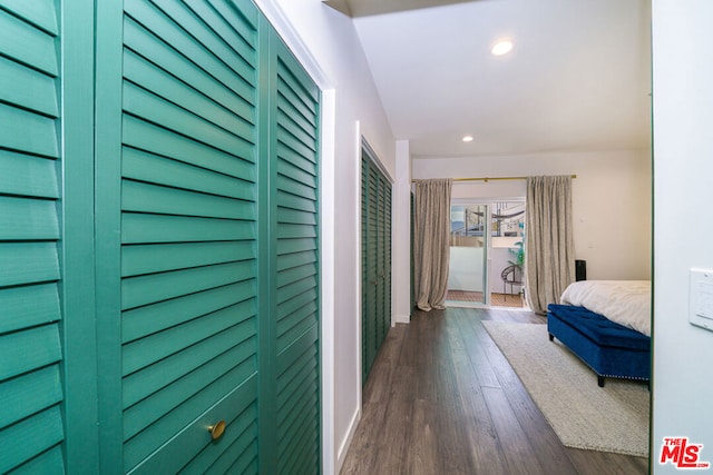 hallway with dark wood-type flooring