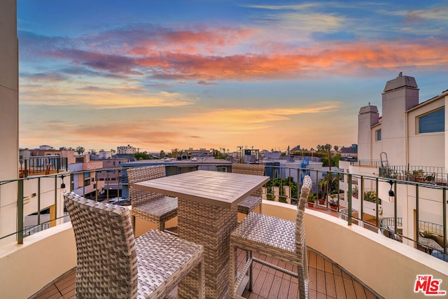 view of balcony at dusk