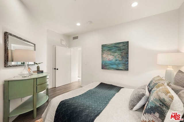 bedroom featuring hardwood / wood-style flooring