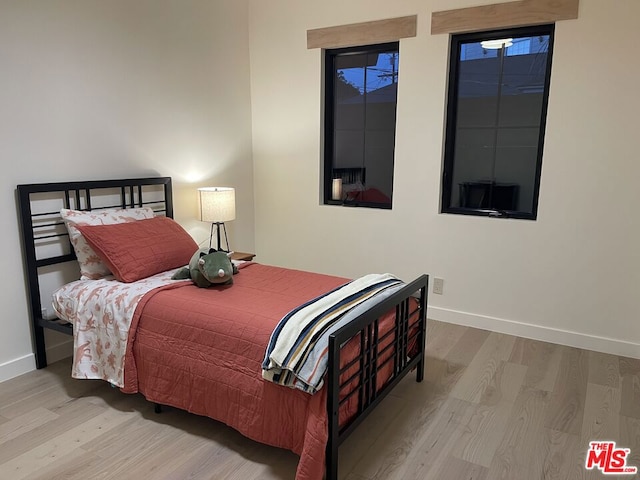 bedroom with light hardwood / wood-style floors