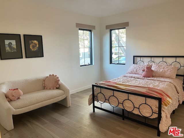 bedroom featuring wood-type flooring