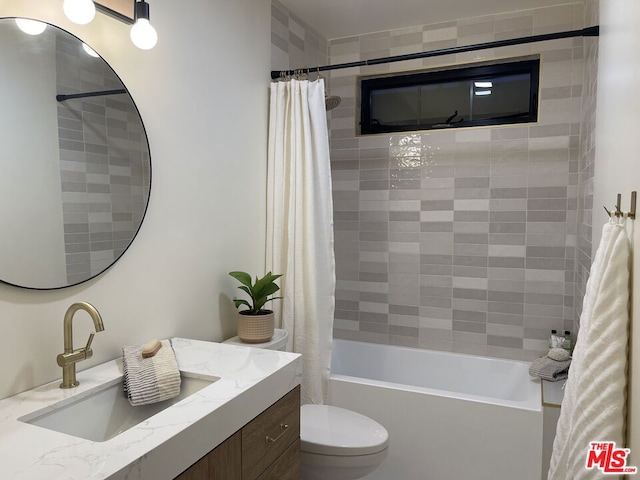 full bathroom with toilet, vanity, and shower / bathtub combination with curtain