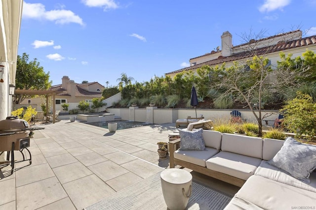 view of patio / terrace featuring a grill and an outdoor hangout area