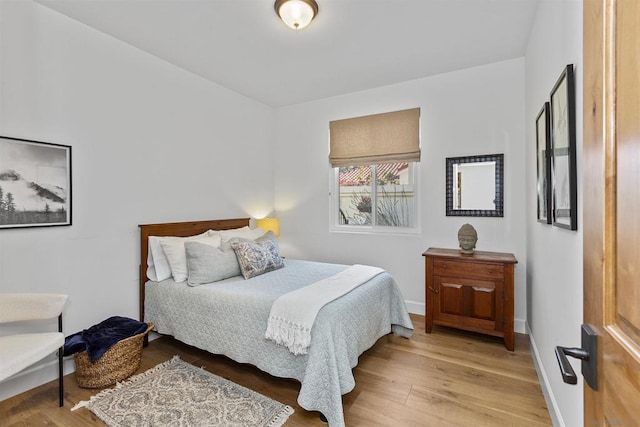 bedroom with hardwood / wood-style floors