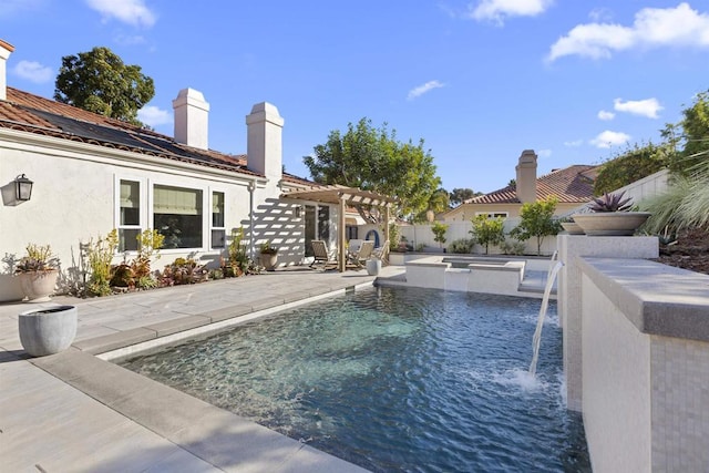 view of swimming pool with pool water feature, an in ground hot tub, a pergola, and a patio