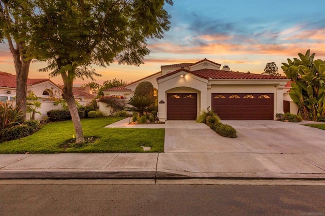 mediterranean / spanish-style house featuring a lawn