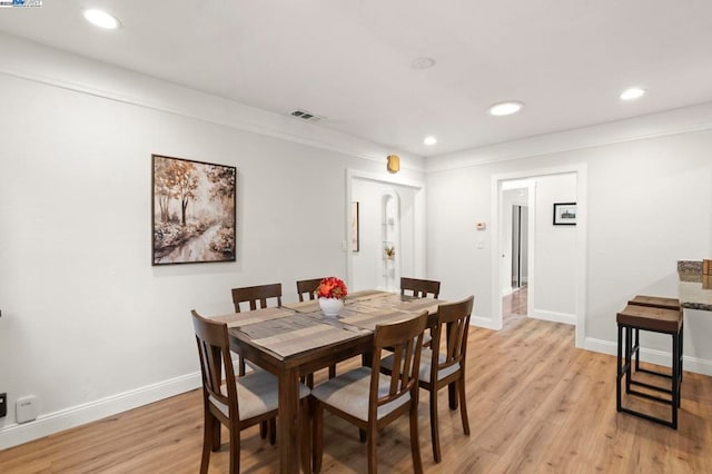 dining space featuring light hardwood / wood-style floors