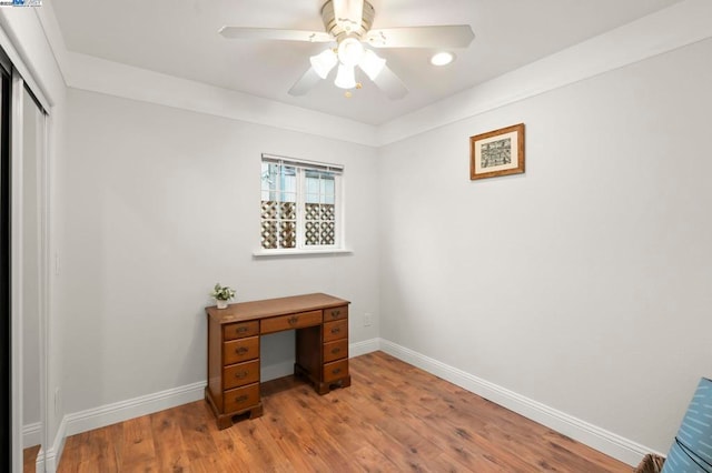 home office featuring ceiling fan and light hardwood / wood-style floors