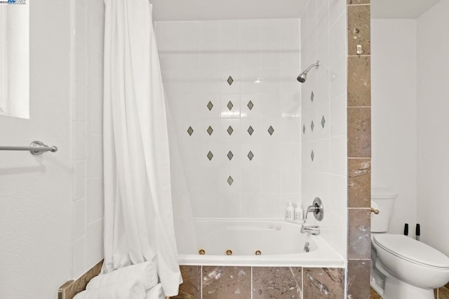 bathroom with toilet and shower / bath combo with shower curtain