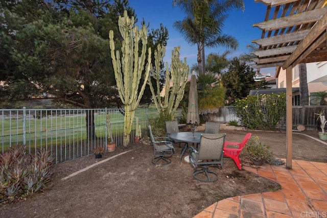 view of patio featuring outdoor dining area and a fenced backyard