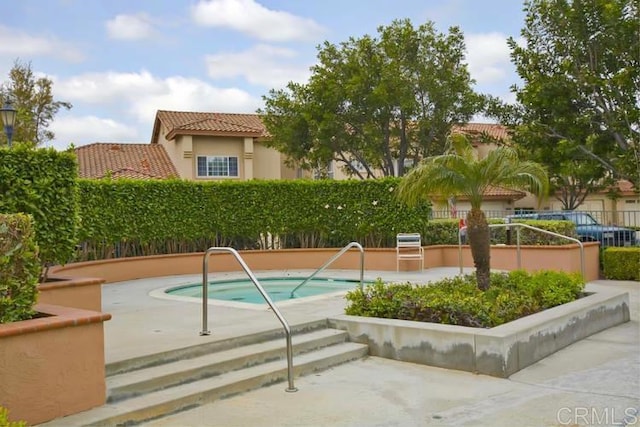 view of pool with fence