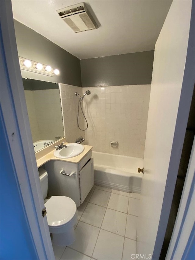 bathroom featuring toilet, shower / bath combination, vanity, visible vents, and tile patterned floors