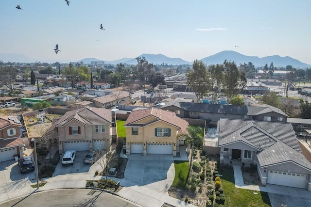 birds eye view of property featuring a mountain view