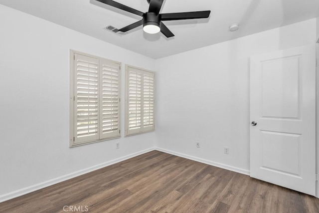 spare room with wood-type flooring and ceiling fan