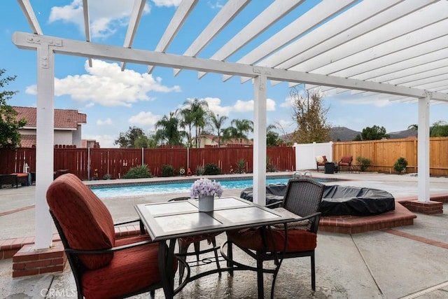 view of patio featuring a pergola and a fenced in pool