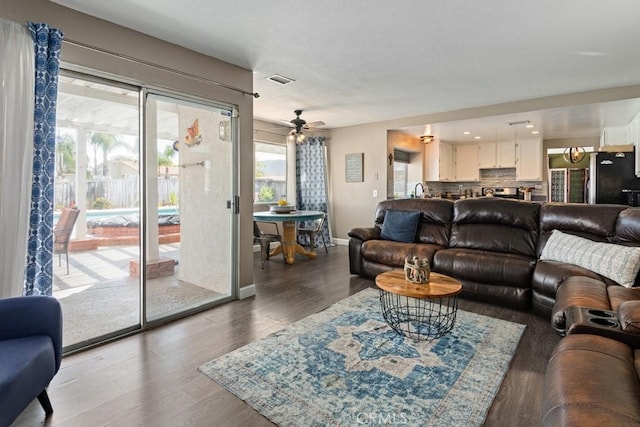 living room with dark wood-type flooring