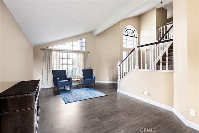 living area featuring high vaulted ceiling, dark hardwood / wood-style floors, and beam ceiling