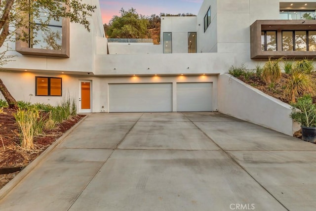 modern home featuring a garage and electric panel