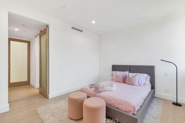 bedroom with light wood-type flooring