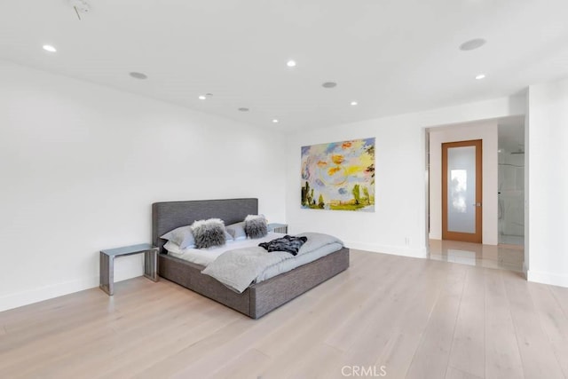 bedroom with light hardwood / wood-style flooring