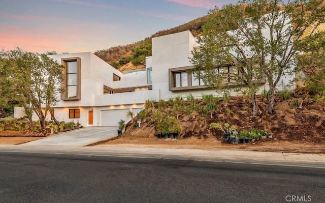 view of front of house featuring a mountain view and a garage