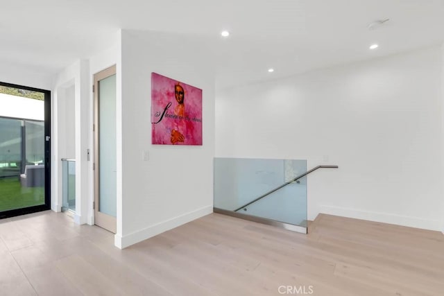 hallway featuring light hardwood / wood-style flooring