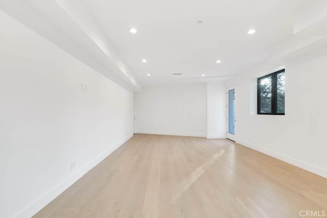 spare room with light hardwood / wood-style floors